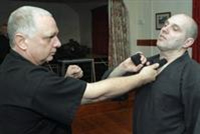 Duncan Hogg showing a pupil some defense moves at Milton Village Hall